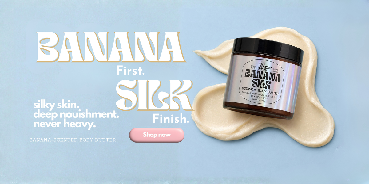 Banana Silk Banana Scented Body Butter jar placed on a cream-colored smear against a light blue background, with large promotional text reading 'BANANA First. SILK Finish.